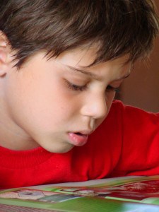 young boy reading young boy reading