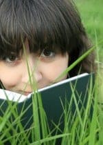 Pretty girl on the grass looking over the book iStock 000006069427XSmall 150x210 Whats New With the Berenstain Bears?