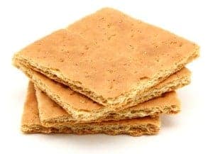 Stack of graham crackers over white.