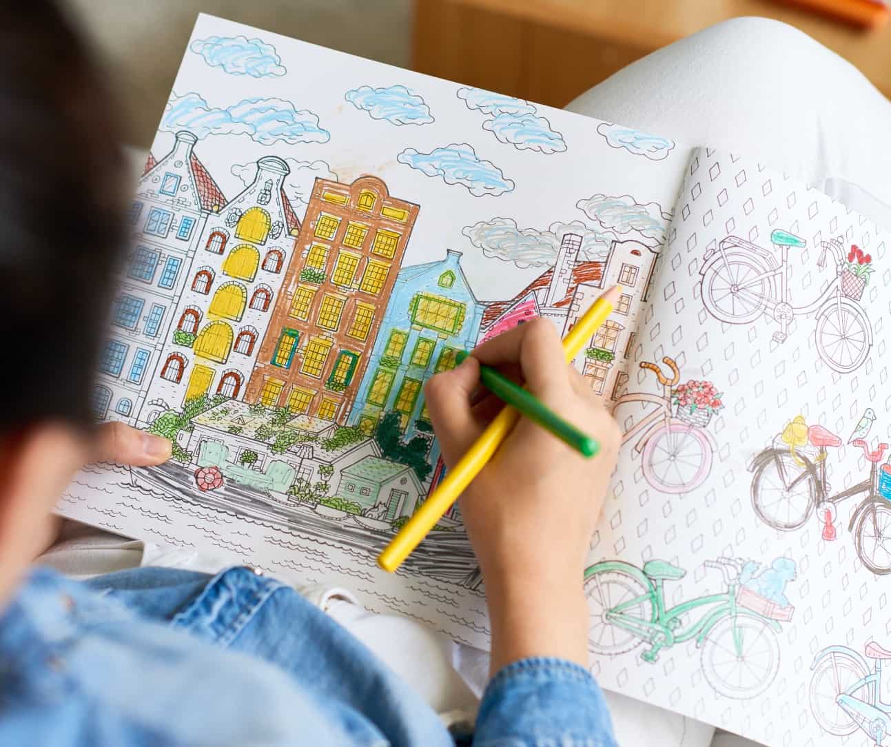 child coloring in a coloring book