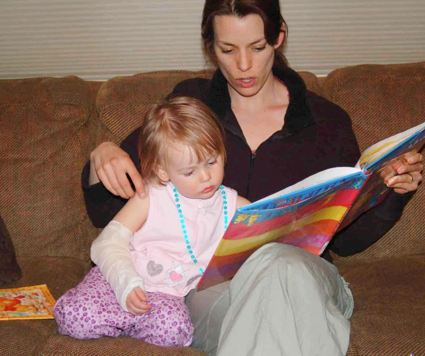 Melissa Taylor and her daughter read aloud