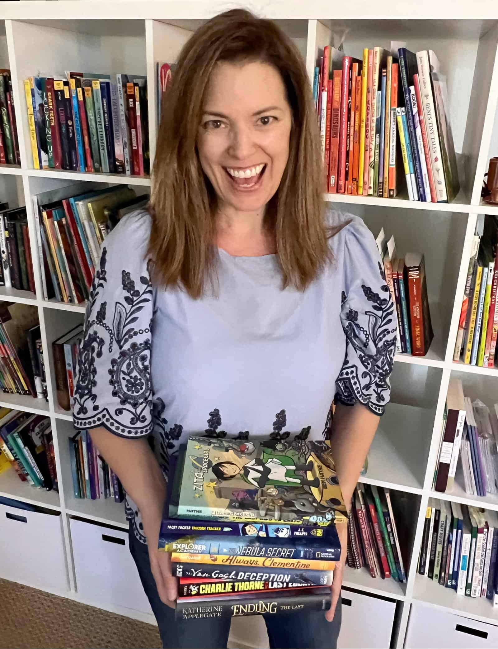 Melissa Taylor holding middle grade books